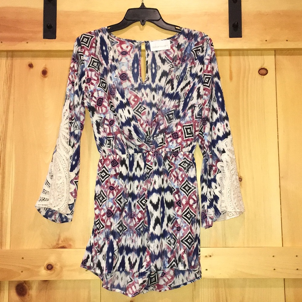 Cute Romper! Bell sleeve with crochet details.